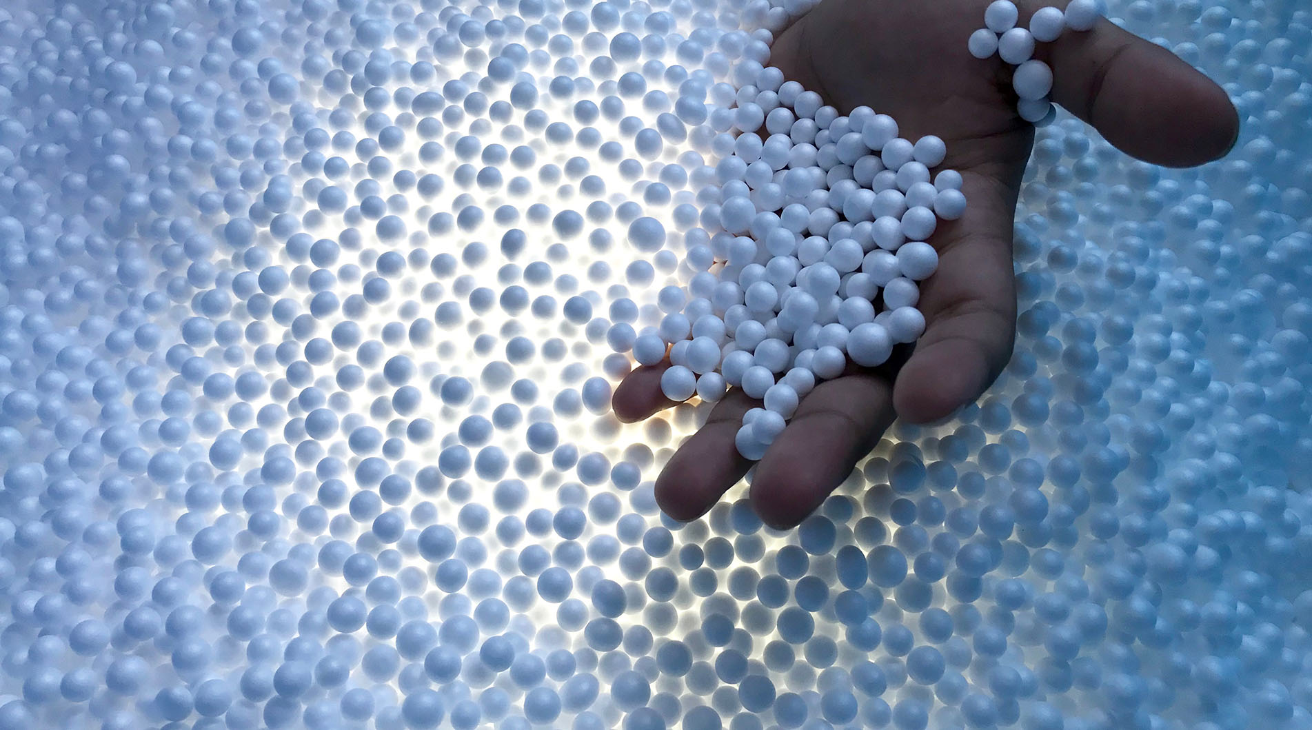 Image showing a hand in a pile of polystyrene beads