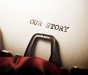 Image showing a typewriter with "Our story" typed on the paper