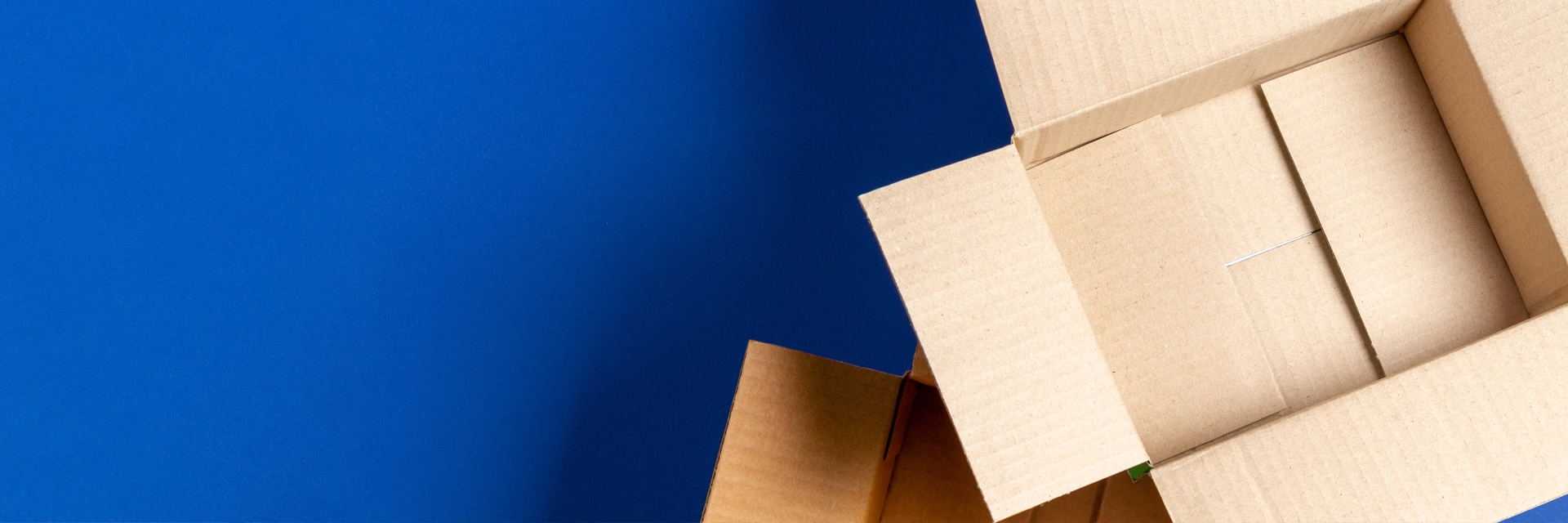 Image showing empty open cardboard on blue background