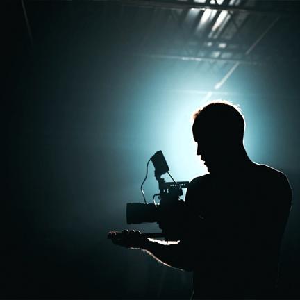 Image showing a man with camera in the dark