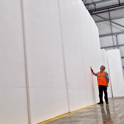 man standing near polystyrene blocks
